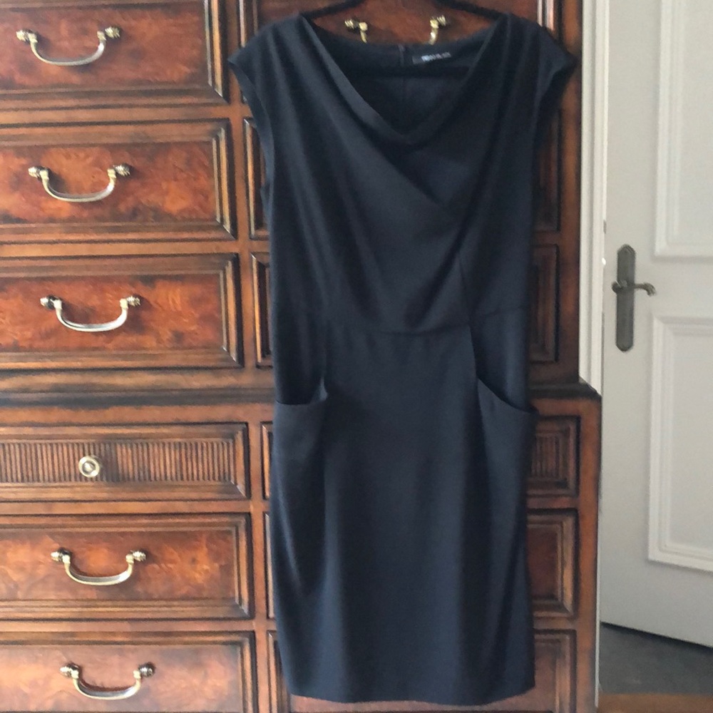 Basic black dress with front pockets.